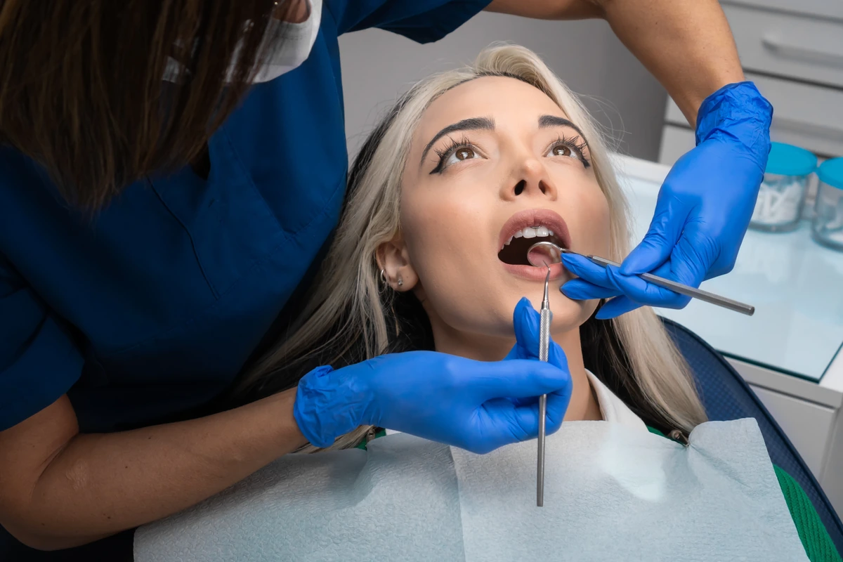 Stomatologist,Checkup.,Close-up,Of,A,Young,Woman,With,Her,Mouth emergency dental exam Paso Robles