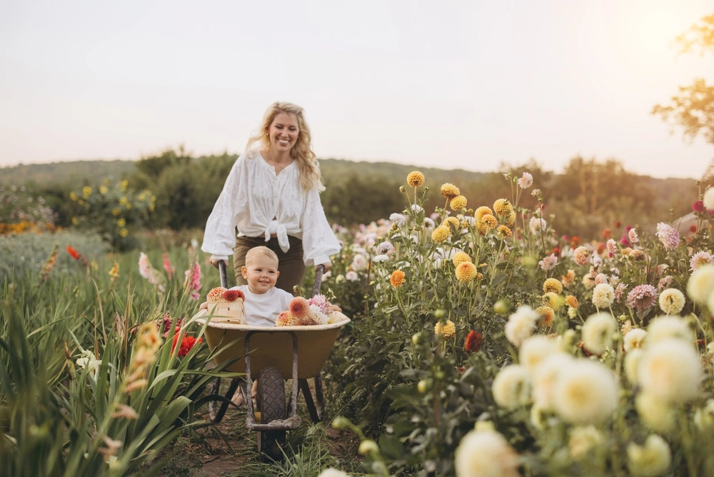 Mother and daughter smiling at the camera outdoors